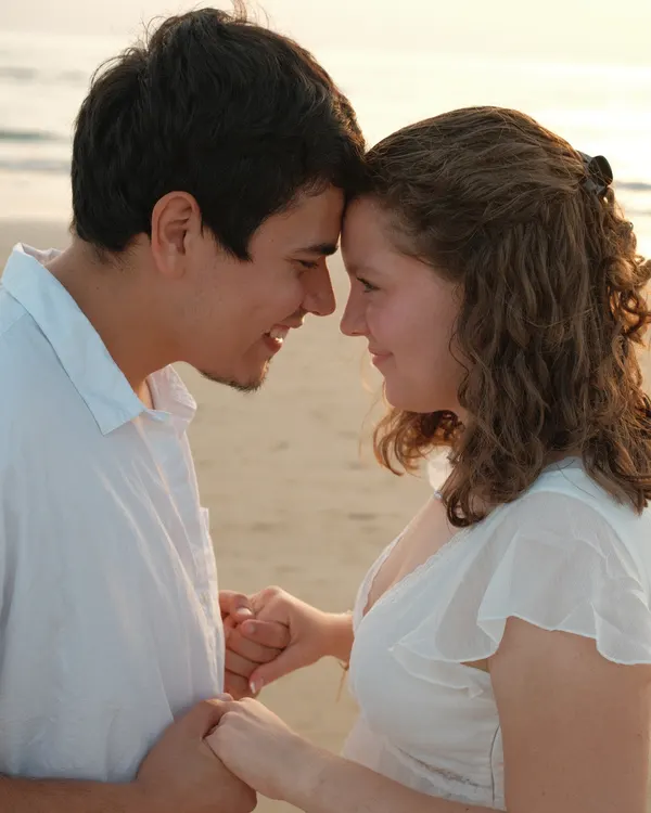 Couple forehead to forehead on the beach