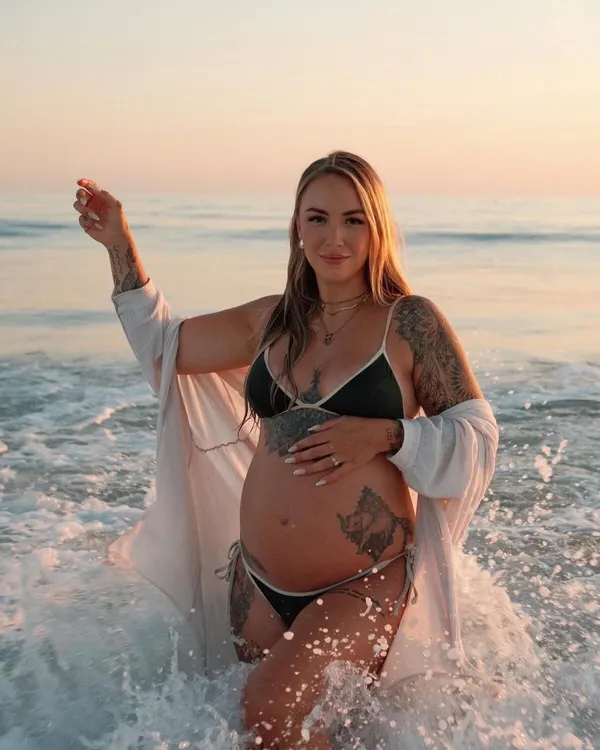 Pregnant woman in the waves